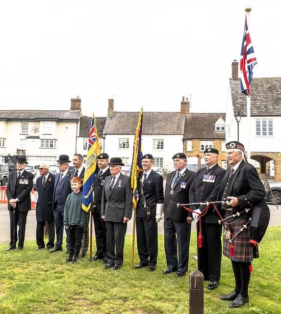 County and Deddington Branch Royal British Legion officers and Standard Bearers (one with his cub scout grandson) and Piper Stewart Carnegie