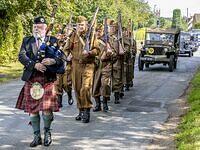 The piper plays as he leads the Oxfordshire Home Guard from the Windmill to Hobart Way